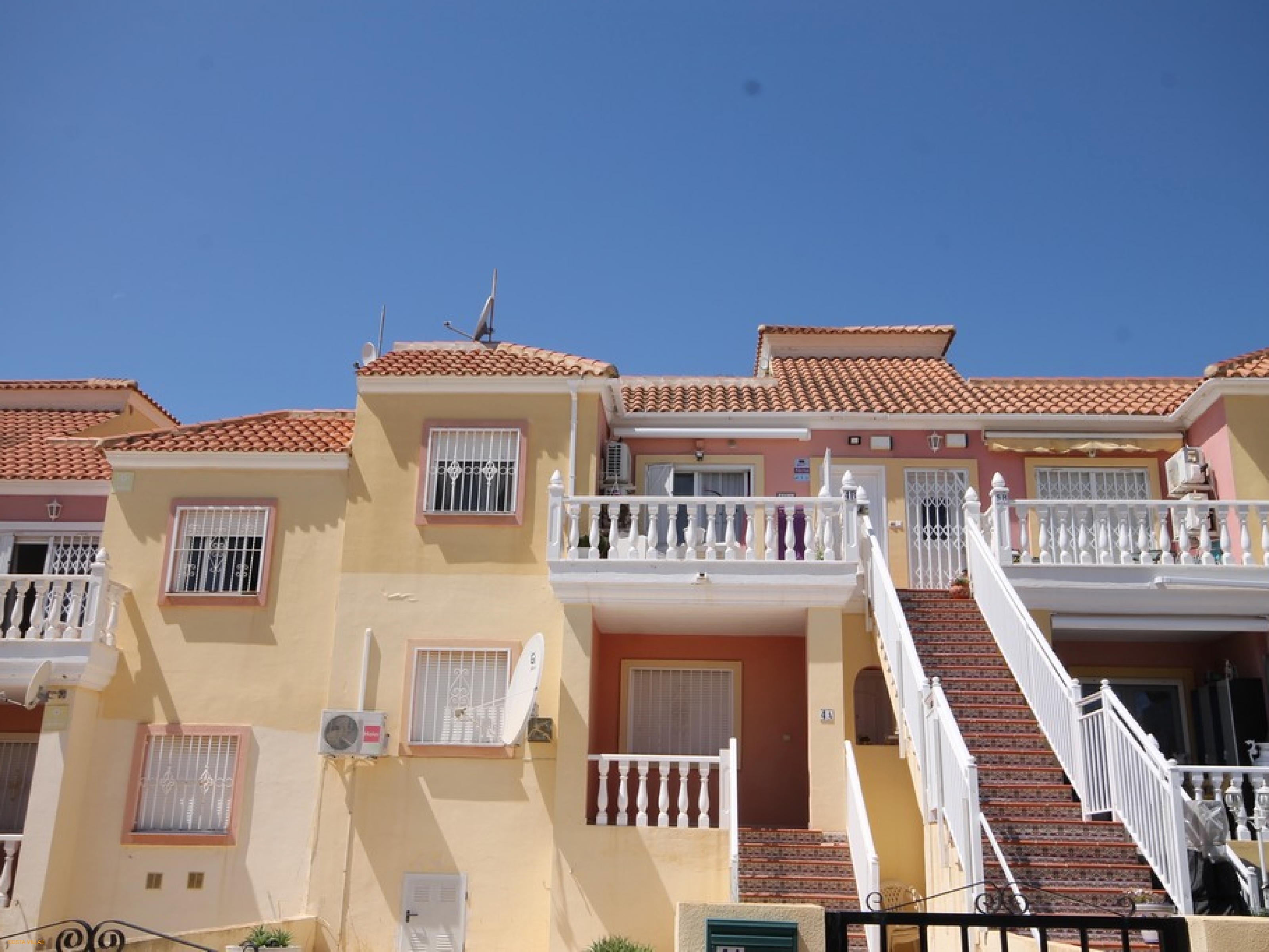 Centrally located top floor apartment with communal pool