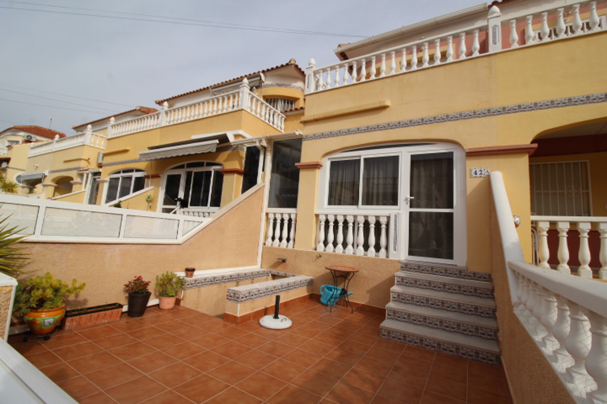 Two bed house with communal pool and basement